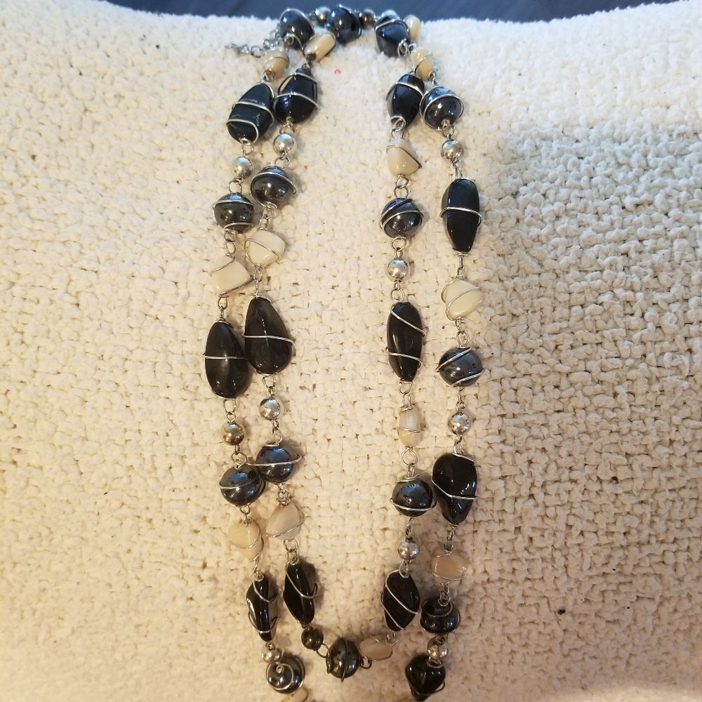 Extra long black cream and silver necklace
